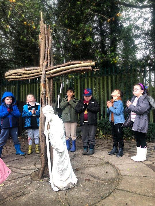 Forest School children finishing their session with prayer.
